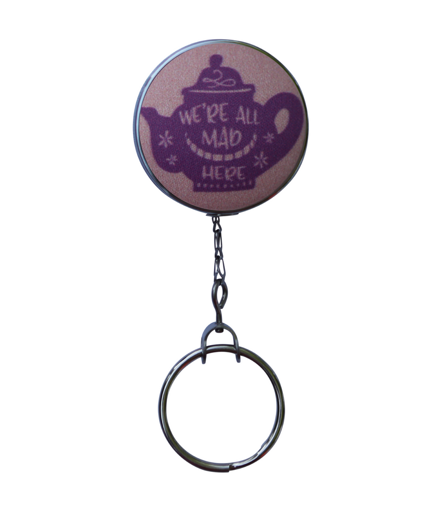 http://jularoo.com/cdn/shop/products/We_re_All_Mad_Here_Jularoo_Designs_Alice_in_Wonderland_ID_Badge_Reel_Quote_2_1024x1024.png?v=1534181777